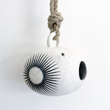 Handmade ceramic birdhouse painted with sun and marigold dot  with hemp rope