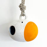 Handmade ceramic birdhouse painted with sun and marigold dot  with hemp rope